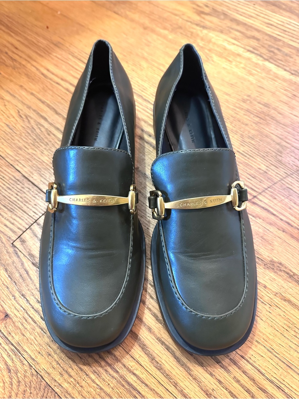 Charles & Keith dark olive leather loafers with gold-tone hardware